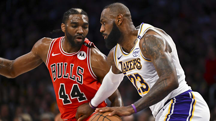 Mar 22, 2025; Los Angeles, California, USA; Los Angeles Lakers forward LeBron James (23) drives the ball against Chicago Bulls forward Patrick Williams (44) during the second half at Crypto.com Arena. Mandatory Credit: Jonathan Hui-Imagn Images