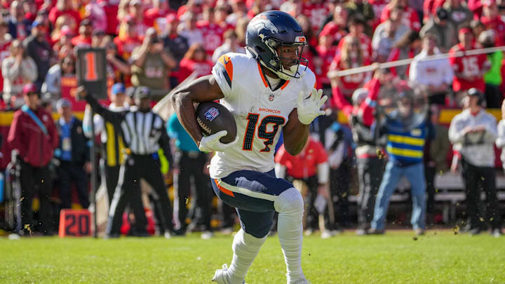 Nov 10, 2024; Kansas City, Missouri, USA; Denver Broncos wide receiver Marvin Mims Jr. (19) runs the ball against the Kansas City Chiefs during the first half at GEHA Field at Arrowhead Stadium. Mandatory Credit: Denny Medley-Imagn Images