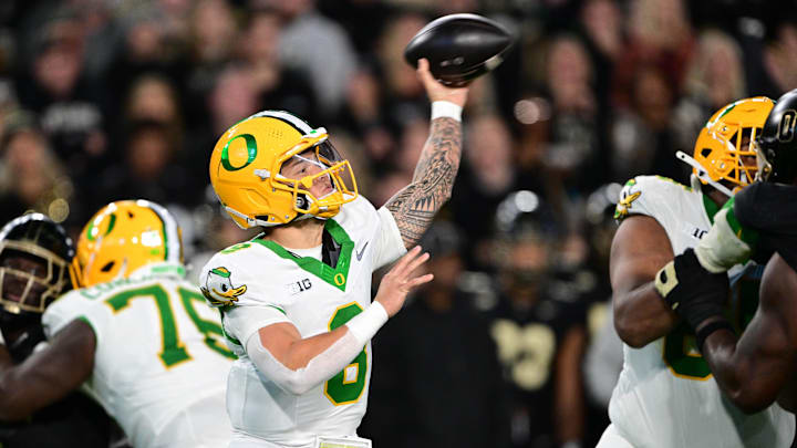 Oct 18, 2024; West Lafayette, Indiana, USA; Oregon Ducks quarterback Dillon Gabriel (8) throws a pass during the second quarter against the Purdue Boilermakers at Ross-Ade Stadium. 