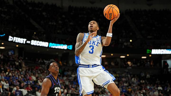 Mar 21, 2026; Greenville, SC, USA; Duke Blue Devils guard Isaiah Evans (3) drives to the basket against Texas Christian University Horned Frogs guard Jayden Pierre (1) during the first half during a second round game of the men's 2026 NCAA Tournament at Bon Secours Wellness Arena. Mandatory Credit: Bob Donnan-Imagn Images Mar 21, 2026; Greenville, SC, USA; Duke Blue Devils guard Isaiah Evans (3) drives to the basket against Texas Christian University Horned Frogs guard Jayden Pierre (1) during the first half during a second round game of the men's 2026 NCAA Tournament at Bon Secours Wellness Arena. Mandatory Credit: Bob Donnan-Imagn Images
