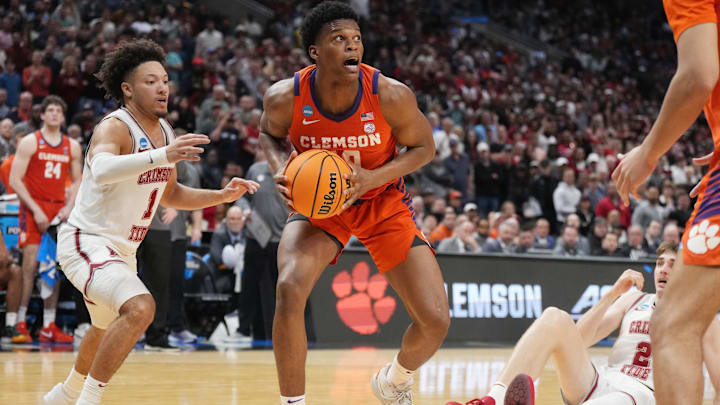 Mar 30, 2024; Los Angeles, CA, USA; Clemson Tigers forward RJ Godfrey (10) controls the ball against Alabama Crimson Tide guard Mark Sears (1) in the second half in the finals of the West Regional of the 2024 NCAA Tournament at Crypto.com Arena. Mandatory Credit: Kirby Lee-Imagn Images