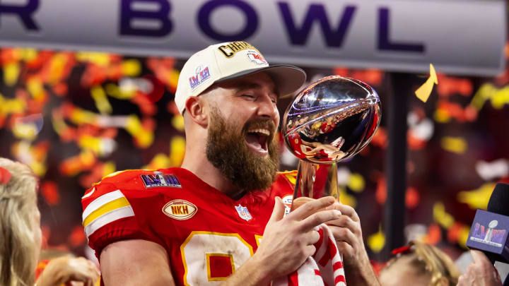 Feb 11, 2024; Paradise, Nevada, USA; Kansas City Chiefs tight end Travis Kelce (87) celebrates with the Vince Lombardi Trophy after defeating the San Francisco 49ers in Super Bowl LVIII at Allegiant Stadium. Mandatory Credit: Mark J. Rebilas-USA TODAY Sports