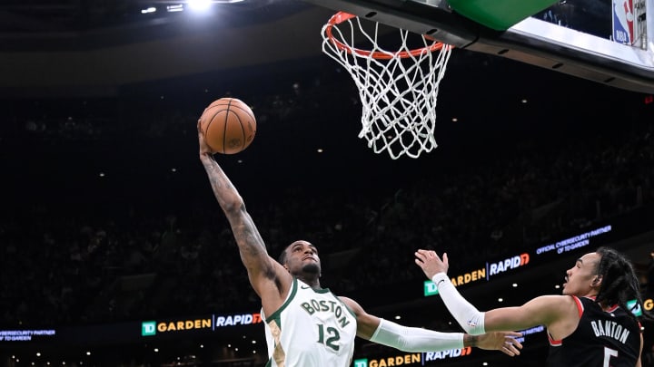 Apr 7, 2024; Boston, Massachusetts, USA; Boston Celtics forward Oshae Brissett (12) shoots the ball against the Portland Trail Blazers during the second half at TD Garden. Mandatory Credit: Eric Canha-USA TODAY Sports