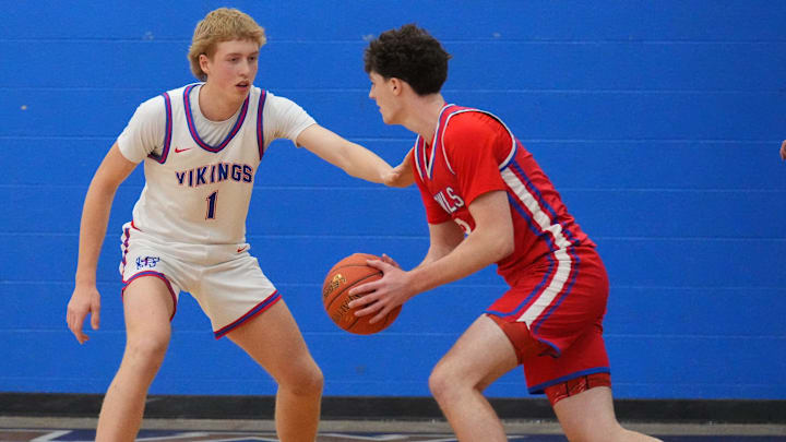 Wisconsin Lutheran's Kager Knueppel (1) guards Slinger's Jack Kohnen (3) during the game at Wisconsin Lutheran High School, in Milwaukee, Wisconsin, Dec. 9, 2025. Wisconsin Lutheran won the game, 68-46.