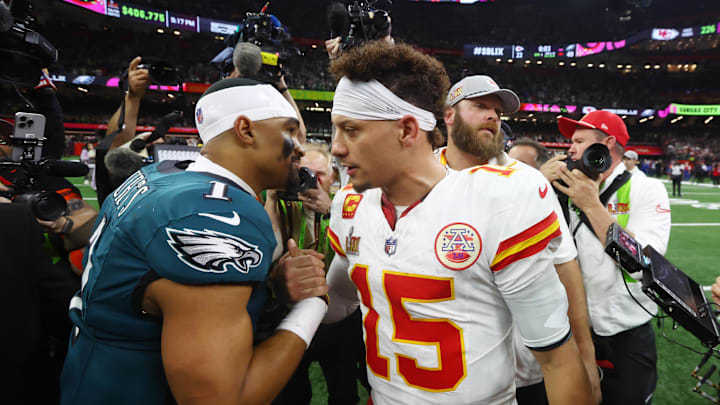 Philadelphia Eagles quarterback Jalen Hurts (1) shakes hands with Kansas City Chiefs quarterback Patrick Mahomes (15) after Super Bowl LIX at Ceasars Superdome. 