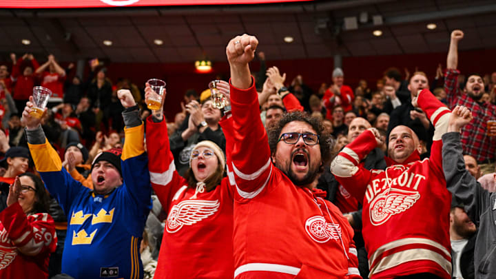 Red Wings fans cheering during the NHL Global Series contest between the Ottawa Senators and Detroit Red Wings.