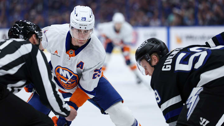 Feb 1, 2025; Tampa, Florida, USA; New York Islanders center Brock Nelson (29) and Tampa Bay Lightning center Jake Guentzel (59) face-off in the first period at Amalie Arena. Mandatory Credit: Nathan Ray Seebeck-Imagn Images