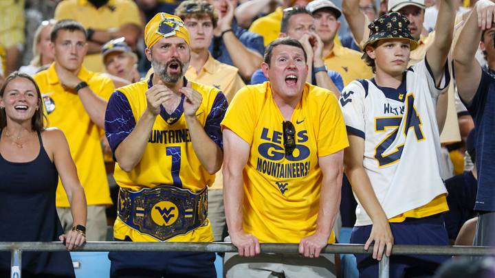 Sep 19, 2026; Charlotte, North Carolina, USA; West Virginia Mountaineers fans cheer during the first quarter against the Virginia Cavaliers at Bank of America Stadium. Mandatory Credit: Ben Queen-Imagn Images Sep 19, 2026; Charlotte, North Carolina, USA; West Virginia Mountaineers fans cheer during the first quarter against the Virginia Cavaliers at Bank of America Stadium. Mandatory Credit: Ben Queen-Imagn Images