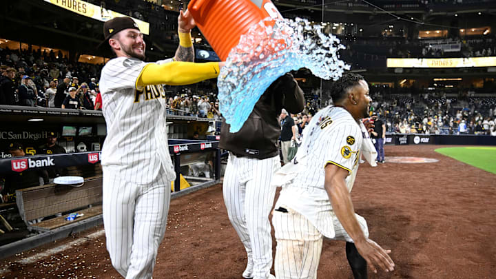Apr 9, 2026; San Diego, California, USA; San Diego Padres center fielder Jackson Merrill (3) attempts to pour the contents of a beverage cooler over shortstop Xander Bogaerts (2) after Bogaerts hit a walk-off grand slam in the twelfth inning against the Colorado Rockies at Petco Park. Mandatory Credit: Denis Poroy-Imagn Images