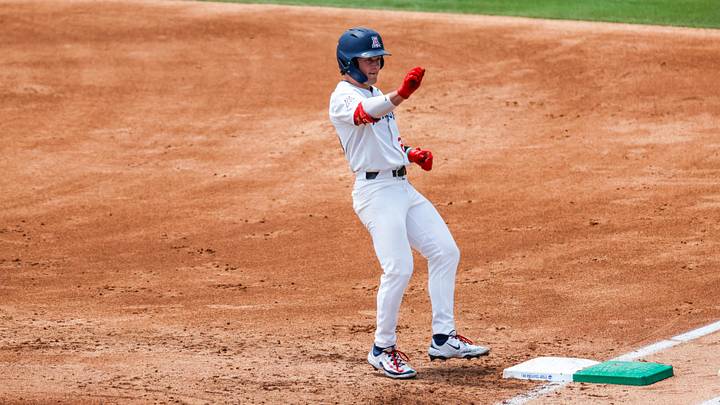 Jun 7, 2025; Chapel Hill, NC, USA;  Arizona infielder Mason White (24) celebrates getting on first base during the first inning of the Super Regionals game against North Carolina in Chapel Hill, North Carolina. Mandatory Credit: Jaylynn Nash-Imagn Images