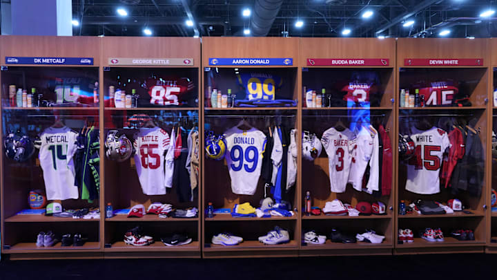 Feb 9, 2024; Las Vegas, NV, USA; A locker room exhibit featuring the jerseys of Seattle Seahawks receiver DK Metcalf (14), San Francisco 49ers tight end George Kittle (85), Los Angeles Rams defensive end Aaron Donald (99), Arizona Cardinals safety Budda Baker (3) and Tampa Bay Buccaneers linebacker Devin White (45) at the NFL Experience at the Mandalay Bay South Convention Center. Mandatory Credit: Kirby Lee-USA TODAY Sports