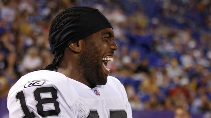 Aug 14, 2006; Minneapolis, MN, USA; Oakland Raiders wide receiver (18) Randy Moss laughs along the sidelines near the end of the victory over the Minnesota Vikings. Oakland defeated Minnesota 16-13. Mandatory Credit: Photo By Bruce Kluckhohn-USA TODAY Sports Copyright (c) 2006 Bruce Kluckhohn
Aug 14, 2006; Minneapolis, MN, USA; Oakland Raiders wide receiver (18) Randy Moss laughs along the sidelines near the end of the victory over the Minnesota Vikings. Oakland defeated Minnesota 16-13. Mandatory Credit: Photo By Bruce Kluckhohn-USA TODAY Sports Copyright (c) 2006 Bruce Kluckhohn