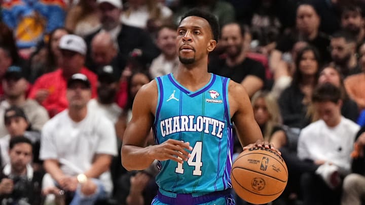 Jan 14, 2024; Miami, Florida, USA; Charlotte Hornets guard Ish Smith (14) dribbles the ball up the court against the Miami Heat during the second half at Kaseya Center. Mandatory Credit: Jasen Vinlove-Imagn Images