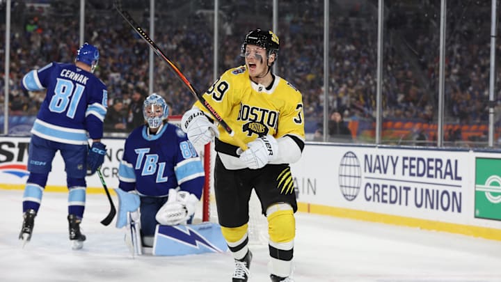 Feb 1, 2026; Tampa Bay, Florida, USA; Boston Bruins center Morgan Geekie (39) reacts after scoring a goal against the Tampa Bay Lightning during the first period in the 2026 Stadium Series ice hockey game at Raymond James Stadium. Mandatory Credit: Kim Klement Neitzel-Imagn Images