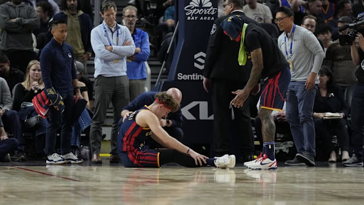 November 20, 2024; San Francisco, California, USA; Golden State Warriors guard Brandin Podziemski (2) reacts after an injury during the fourth quarter against the Atlanta Hawks at Chase Center. 