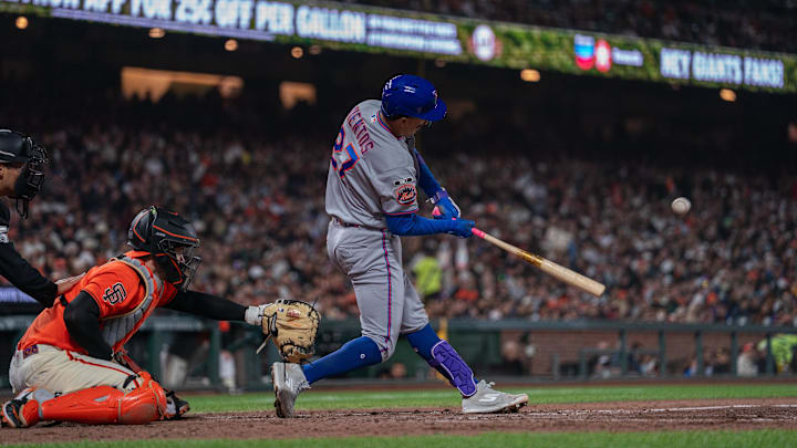Apr 3, 2026; San Francisco, California, USA; New York Mets designated hitter Mark Vientos (27) hits an RBI single against the San Francisco Giants during the seventh inning at Oracle Park. Mandatory Credit: Neville E. Guard-Imagn Images
