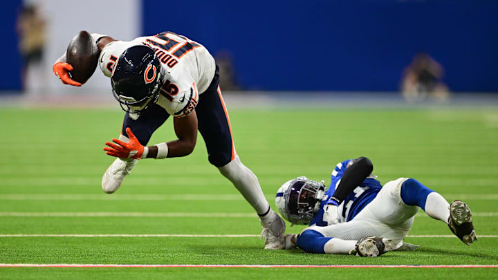 Rome Odunze is tripped up by Dallis Flowers in the Bears' 21-16 loss to Indianapolis.