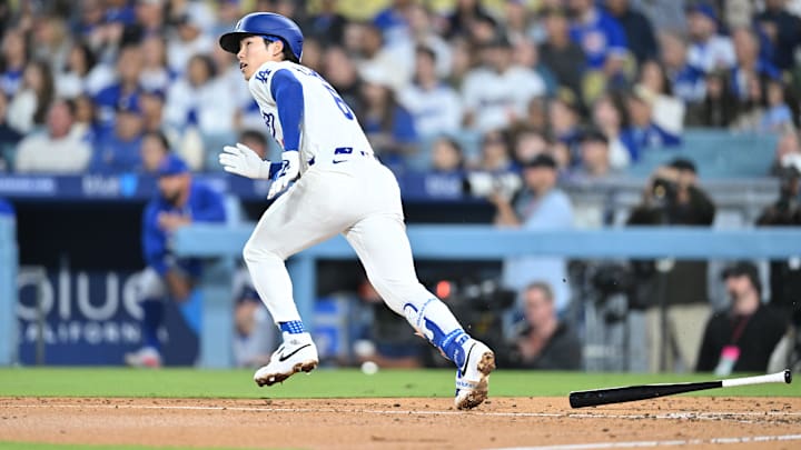 Apr 24, 2026; Los Angeles, California, USA;  Los Angeles Dodgers second baseman Hyeseong Kim (6) hits an RBI single during the fourth inning against the Chicago Cubs at Dodger Stadium. Mandatory Credit: William Liang-Imagn Images