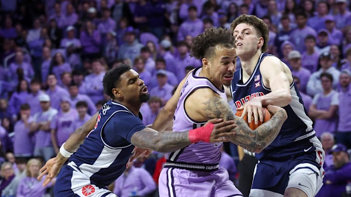 Feb 11, 2025; Manhattan, Kansas, USA; Kansas State Wildcats guard Max Jones (2) dribbles between Arizona Wildcats guard Anthony Dell'Orso (3) and guard K.J. Lewis (5) during the first half at Bramlage Coliseum. Mandatory Credit: Scott Sewell-Imagn Images