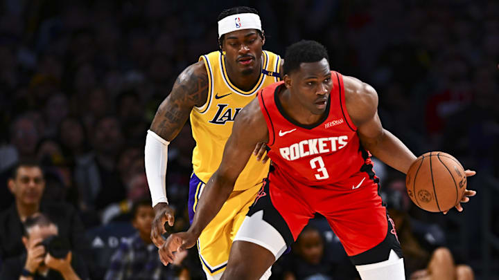 Former  Houston Rockets center N'Faly Dante (3) moves the ball against Los Angeles Lakers forward Jarred Vanderbilt (2) and guard Austin Reaves (15) during the second half at Crypto.com Arena.