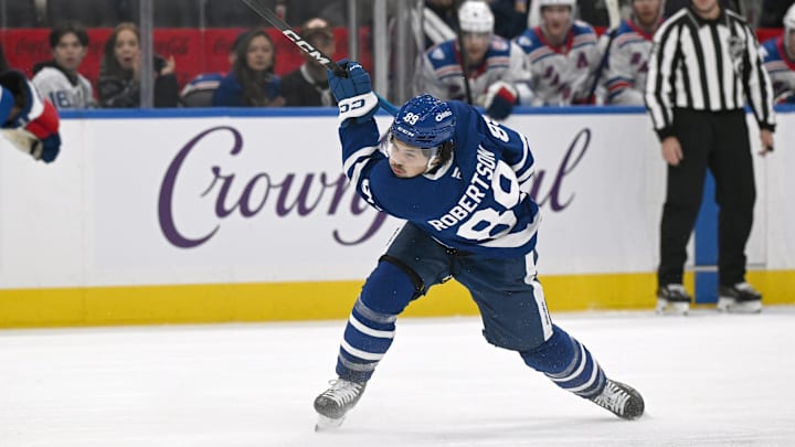 Oct 16, 2025; Toronto, Ontario, CAN; Toronto Maple Leafs forward Nick Robertson (89) follows through on a slapshot against the New York Rangers in the third period at Scotiabank Arena. Mandatory Credit: Dan Hamilton-Imagn Images