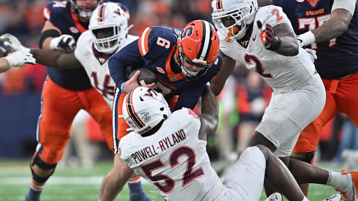 Nov 2, 2024; Syracuse, New York, USA; Virginia Tech Hokies defensive lineman Antwaun Powell-Ryland (52) sacks Syracuse Orange quarterback Kyle McCord (6) in the fourth quarter at JMA Wireless Dome. Mandatory Credit: Mark Konezny-Imagn Images