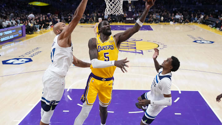 Oct 24, 2025; Los Angeles, California, USA; Los Angeles Lakers center Deandre Ayton (5) shoots the ball against Minnesota Timberwolves center Rudy Gobert (27) and forward Jaden McDaniels (3) in the second half at Crypto.com Arena. Mandatory Credit: Kirby Lee-Imagn Images Oct 24, 2025; Los Angeles, California, USA; Los Angeles Lakers center Deandre Ayton (5) shoots the ball against Minnesota Timberwolves center Rudy Gobert (27) and forward Jaden McDaniels (3) in the second half at Crypto.com Arena. Mandatory Credit: Kirby Lee-Imagn Images
