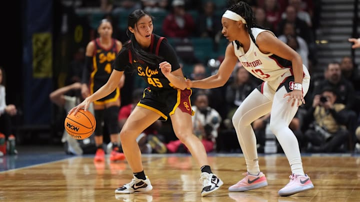 Mar 10, 2024; Las Vegas, NV, USA; Southern California Trojans guard Kayla Padilla (45) dribbles against Stanford Cardinal guard Chloe Clardy (13) jn the first half of the Pac-12 Tournament women's championship game at MGM Grand Garden Arena. Mandatory Credit: Kirby Lee-Imagn Images
