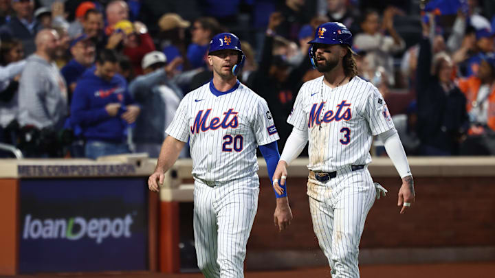 Oct 18, 2024; New York City, New York, USA; New York Mets first baseman Pete Alonso (20) and designated hitter Jesse Winker (3) walk back to the dugout after scoring during the third inning against the Los Angeles Dodgers during game five of the NLCS for the 2024 MLB playoffs at Citi Field. Mandatory Credit: Vincent Carchietta-Imagn Images Oct 18, 2024; New York City, New York, USA; New York Mets first baseman Pete Alonso (20) and designated hitter Jesse Winker (3) walk back to the dugout after scoring during the third inning against the Los Angeles Dodgers during game five of the NLCS for the 2024 MLB playoffs at Citi Field. Mandatory Credit: Vincent Carchietta-Imagn Images