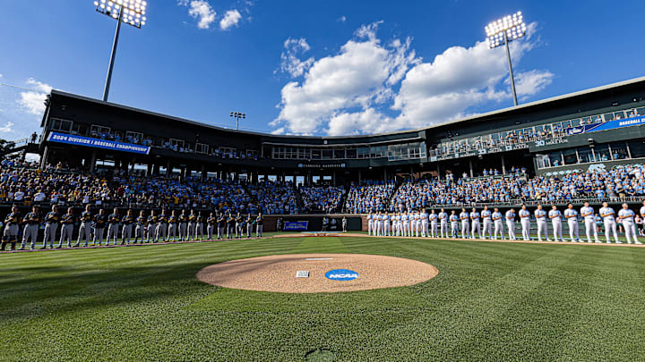 Jun 7, 2024; Chapel Hill, NC, USA; The North Carolina Tar Heels and West Virginia Mountaineers stand for the playing of the national anthem prior to the DI Baseball Super Regional at Boshamer Stadium.  Mandatory Credit: Jeffrey Camarati-Imagn Images
