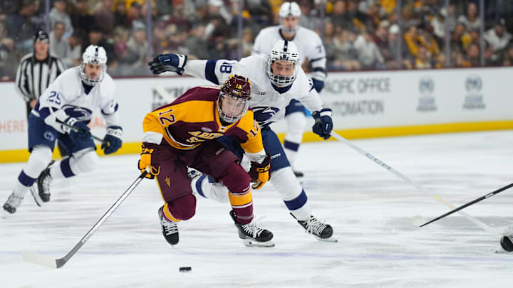 Oct 3, 2025; Tempe, AZ, USA; Arizona State forward Cullen Potter (12) and Penn State Nittany Lions forward Aiden Fink (18) chase a puck during the first period at Mullett Arena. Mandatory Credit: Joe Camporeale-Imagn Images Oct 3, 2025; Tempe, AZ, USA; Arizona State forward Cullen Potter (12) and Penn State Nittany Lions forward Aiden Fink (18) chase a puck during the first period at Mullett Arena. Mandatory Credit: Joe Camporeale-Imagn Images
