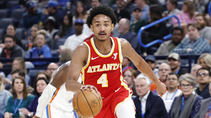 Oct 17, 2024; Oklahoma City, Oklahoma, USA; Atlanta Hawks guard Kobe Bufkin (4) drives to the basket against the Oklahoma City Thunder during the second quarter at Paycom Center. Mandatory Credit: Alonzo Adams-Imagn Images
