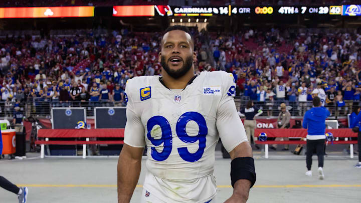 Nov 26, 2023; Glendale, Arizona, USA; Los Angeles Rams defensive tackle Aaron Donald (99) against the Arizona Cardinals at State Farm Stadium. Mandatory Credit: Mark J. Rebilas-Imagn Images