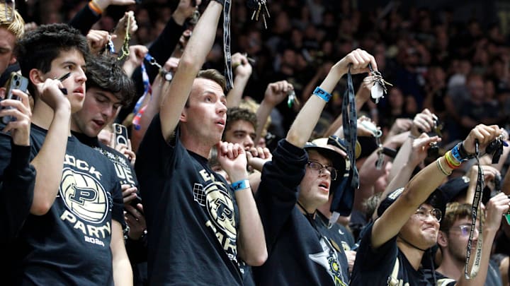 The Purdue student section shakes keys at a volleyball match