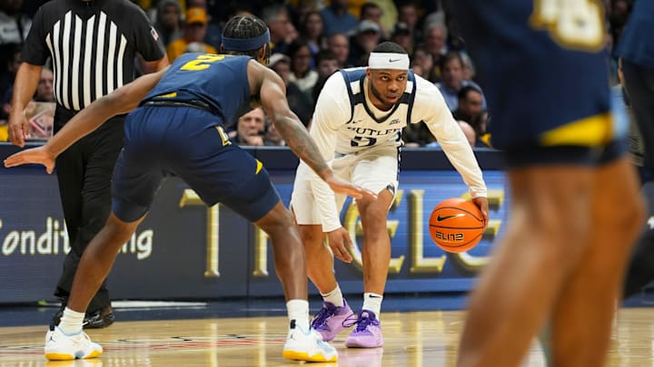 Butler Bulldogs guard Posh Alexander (5) sets up the offense Tuesday, Feb. 13, 2024, during the game