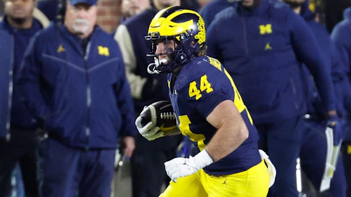 Nov 23, 2024; Ann Arbor, Michigan, USA;  Michigan Wolverines tight end Max Bredeson (44) runs the ball against the Northwestern Wildcats at Michigan Stadium. Mandatory Credit: Rick Osentoski-Imagn Images