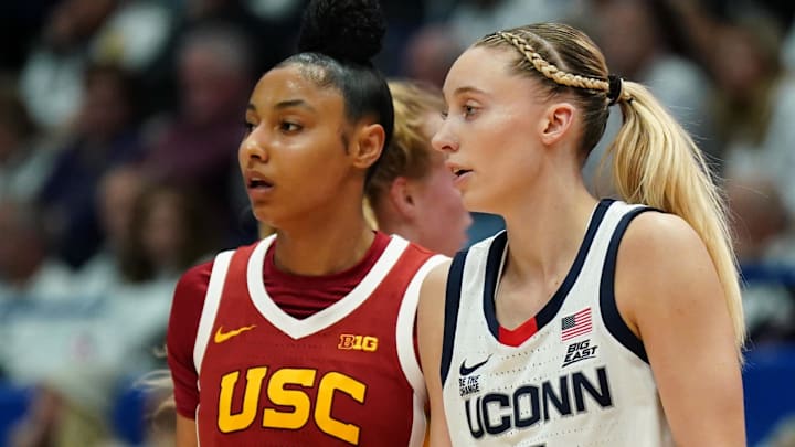 Dec 21, 2024; Hartford, Connecticut, USA; UConn Huskies guard Paige Bueckers (5) and USC Trojans guard JuJu Watkins (12) on the court in the first half at XL Center. Mandatory Credit: David Butler II-Imagn Images Dec 21, 2024; Hartford, Connecticut, USA; UConn Huskies guard Paige Bueckers (5) and USC Trojans guard JuJu Watkins (12) on the court in the first half at XL Center. Mandatory Credit: David Butler II-Imagn Images