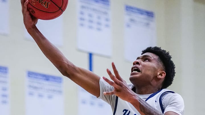 Nicolet's Davion Hannah (25) drives to the hoop against St. Thomas More during the Rick Majerus Wisconsin Basketball Yearbook Shootout at Concordia University in Mequon on Friday, Dec. 29, 2023. Nicolet's Davion Hannah (25) drives to the hoop against St. Thomas More during the Rick Majerus Wisconsin Basketball Yearbook Shootout at Concordia University in Mequon on Friday, Dec. 29, 2023.