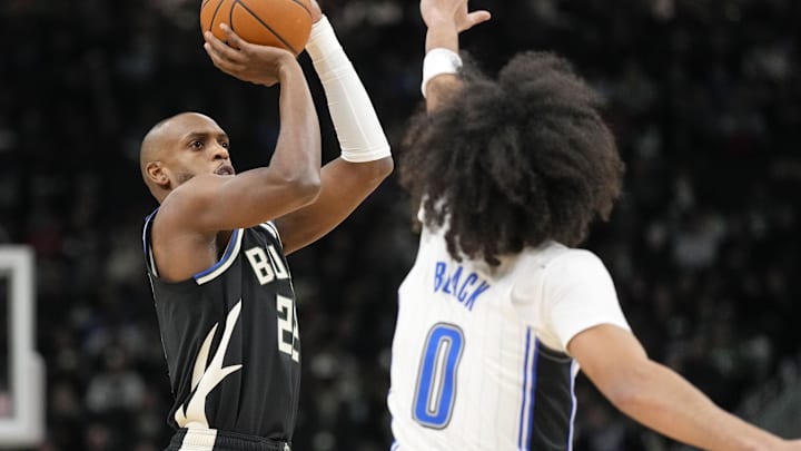 Jan 15, 2025; Milwaukee, Wisconsin, USA; Milwaukee Bucks forward Khris Middleton (22) shoots against Orlando Magic guard Anthony Black (0) during the first quarter at Fiserv Forum. Mandatory Credit: Jeff Hanisch-Imagn Images Jan 15, 2025; Milwaukee, Wisconsin, USA; Milwaukee Bucks forward Khris Middleton (22) shoots against Orlando Magic guard Anthony Black (0) during the first quarter at Fiserv Forum. Mandatory Credit: Jeff Hanisch-Imagn Images