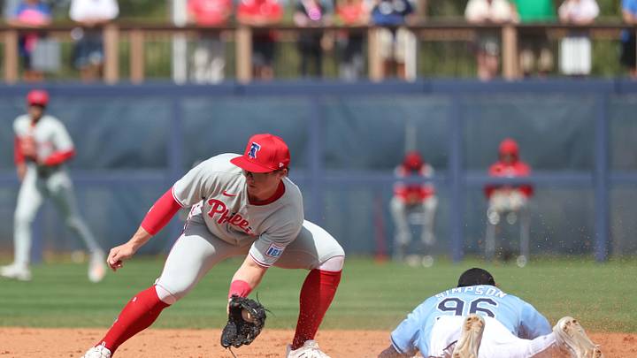 Feb 25, 2025; Port Charlotte, Florida, USA;  Tampa Bay Rays outfielder Chandler Simpson (96) slides safely into second base against Philadelphia Phillies infielder Aidan Miller (81) at Charlotte Sports Park. Mandatory Credit: Kim Klement Neitzel-Imagn Images
