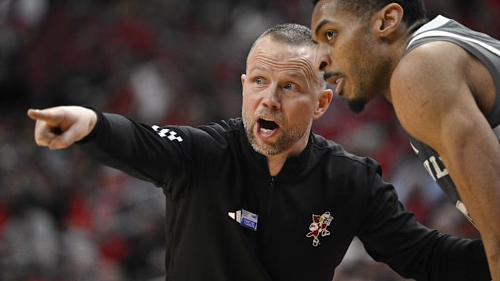 Jan 28, 2025; Louisville, Kentucky, USA;  Louisville Cardinals head coach Pat Kelsey talks with center Frank Anselem-Ibe (13) during the second half against the Wake Forest Demon Deacons at KFC Yum! Center. Louisville defeated Wake Forest 72-59. Mandatory Credit: Jamie Rhodes-Imagn Images