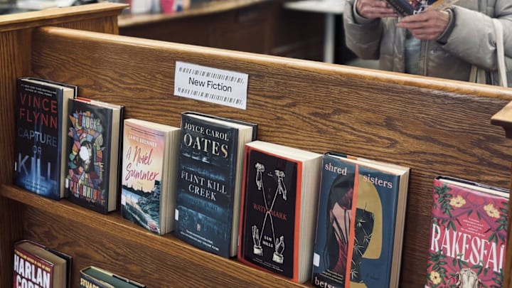 Jane Fitzpatrick, of Wells, Maine, looks through a book at the Kennebunk Free Library on April 2, 2025.