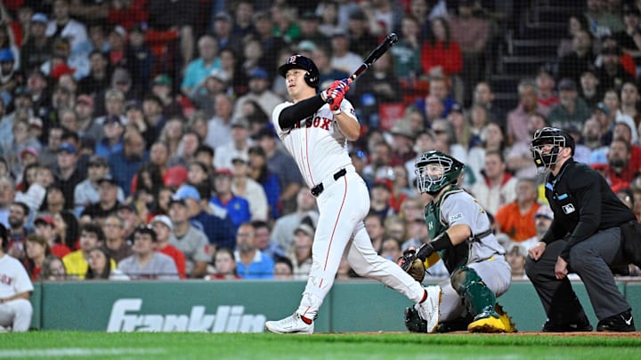 Sep 17, 2025; Boston, Massachusetts, USA; Boston Red Sox right fielder Rob Refsnyder (30) hits a one run home run against the Athletics during the second inning at Fenway Park. Mandatory Credit: Eric Canha-Imagn Images