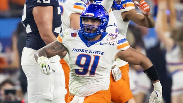 Dec 31, 2024; Glendale, AZ, USA; Boise State Broncos defensive end Ahmed Hassanein (91) celebrates a play against the Penn State Nittany Lions during the Fiesta Bowl at State Farm Stadium. Mandatory Credit: Mark J. Rebilas-Imagn Images