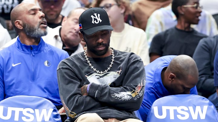 Mar 16, 2025; Dallas, Texas, USA; Dallas Mavericks guard Kyrie Irving sits on the bench against the Philadelphia 76ers  during the first half at American Airlines Center. Mandatory Credit: Kevin Jairaj-Imagn Images