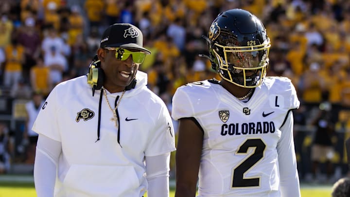 Oct 7, 2023; Tempe, Arizona, USA; Colorado Buffaloes head coach Deion Sanders with son and quarterback Shedeur Sanders (2) against the Arizona State Sun Devils at Mountain America Stadium. 
