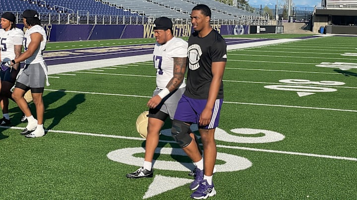 Zaydrius Rainey-Sale, right, leaves the field with fellow linebacker Deven Bryant. 
