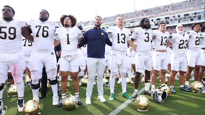 Sep 27, 2025; Fayetteville, Arkansas, USA; Notre Dame Fighting Irish head coach Marcus Freeman leads the team in celebration after the game against the Arkansas Razorbacks at Donald W. Reynolds Razorback Stadium. Notre Dame won 56-13. Mandatory Credit: Nelson Chenault-Imagn Images Sep 27, 2025; Fayetteville, Arkansas, USA; Notre Dame Fighting Irish head coach Marcus Freeman leads the team in celebration after the game against the Arkansas Razorbacks at Donald W. Reynolds Razorback Stadium. Notre Dame won 56-13. Mandatory Credit: Nelson Chenault-Imagn Images