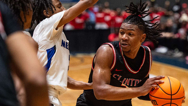 Meridian Wildcats' guard Jorden Harbour (3) tries to block Clinton Arrows' guard Trey Alexander (3) during the MHSAA Class 7A state final game at the Mississippi Coliseum in Jackson, Miss., on Saturday, Mar. 2, 2024. The Meridian Wildcats won 54 to 50.