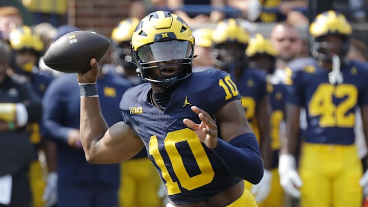 Sep 14, 2024; Ann Arbor, Michigan, USA; Michigan Wolverines quarterback Alex Orji (10) passes second half against the Arkansas State Red Wolves at Michigan Stadium. Sep 14, 2024; Ann Arbor, Michigan, USA; Michigan Wolverines quarterback Alex Orji (10) passes second half against the Arkansas State Red Wolves at Michigan Stadium.